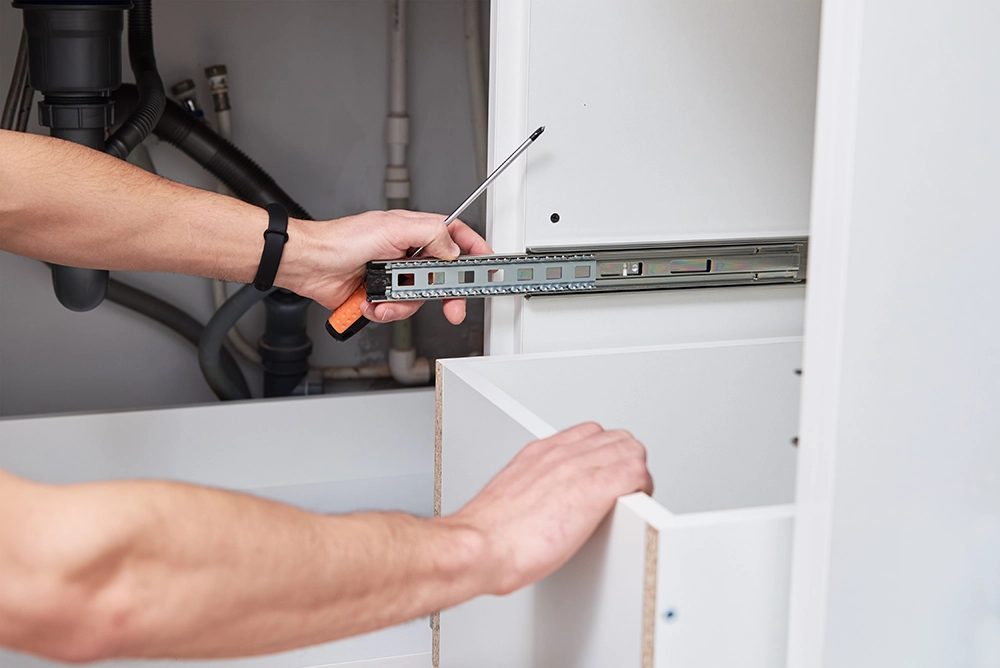 Orlando remodeling contractor installing kitchen cabinet during a home remodel in Florida